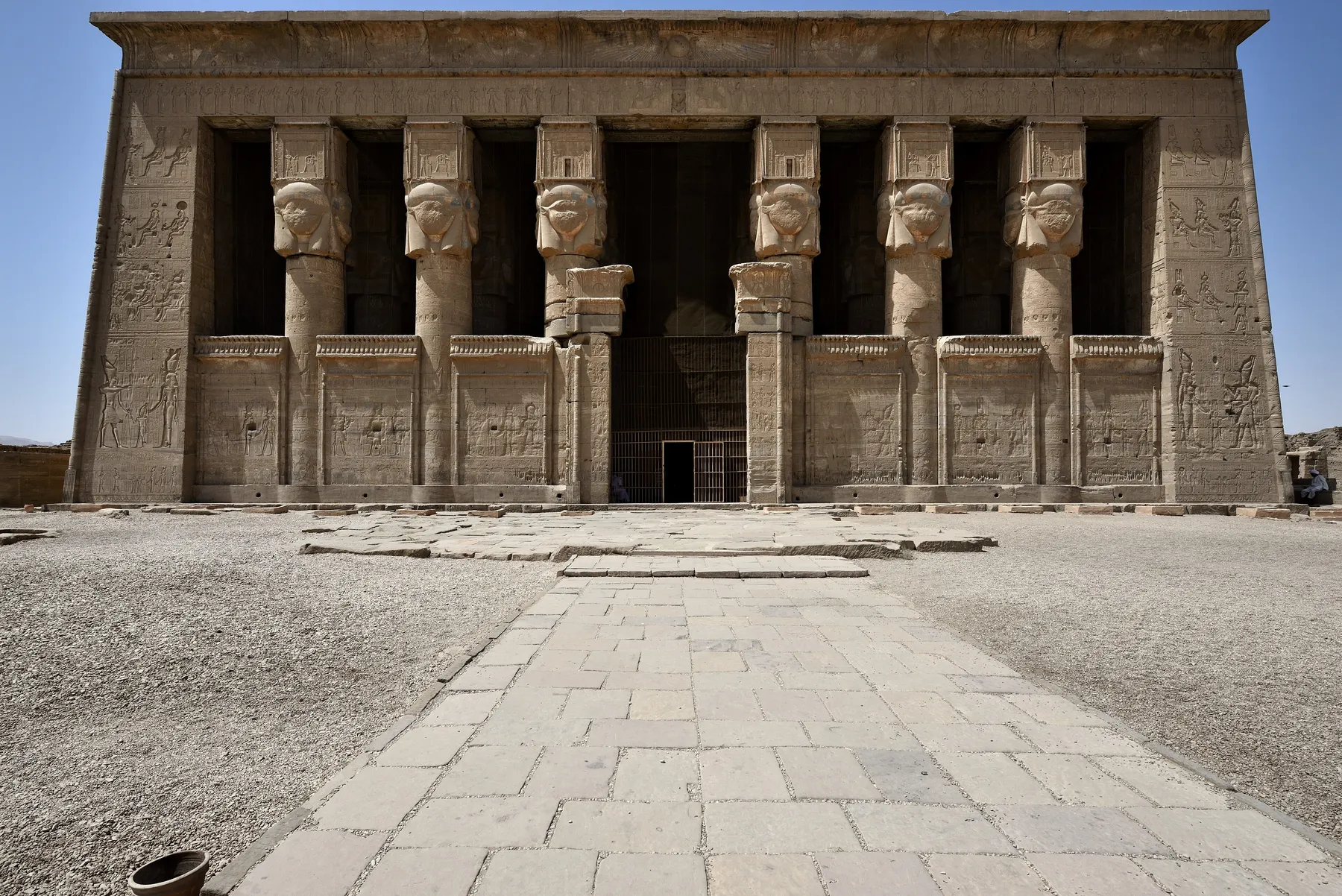 The facade of the Temple of Hathor at Dendera, with six columns crowned by the face of the goddess.
