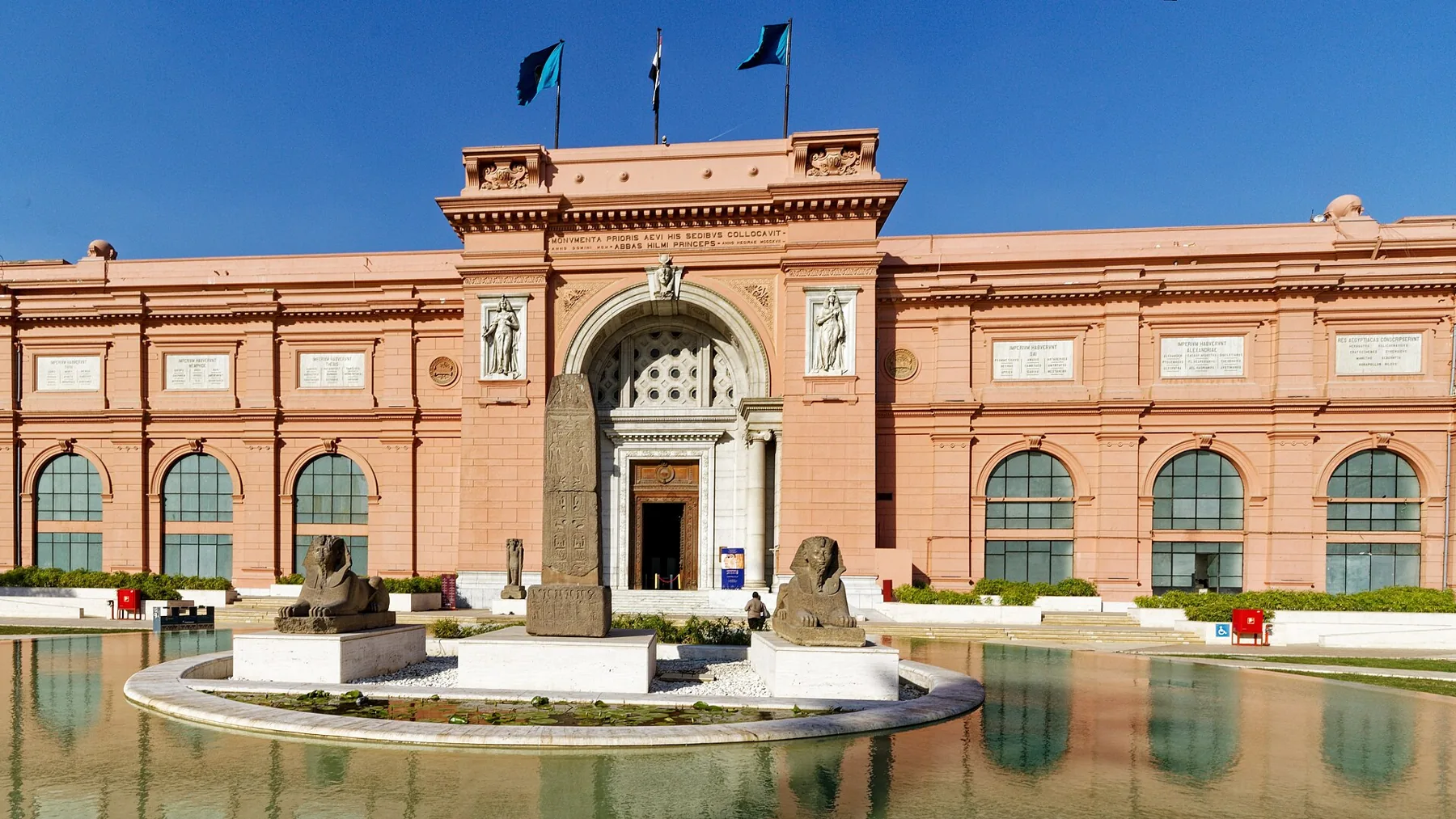The pink facade of the Egyptian Museum on Tahrir Square, with the garden pool in front.
