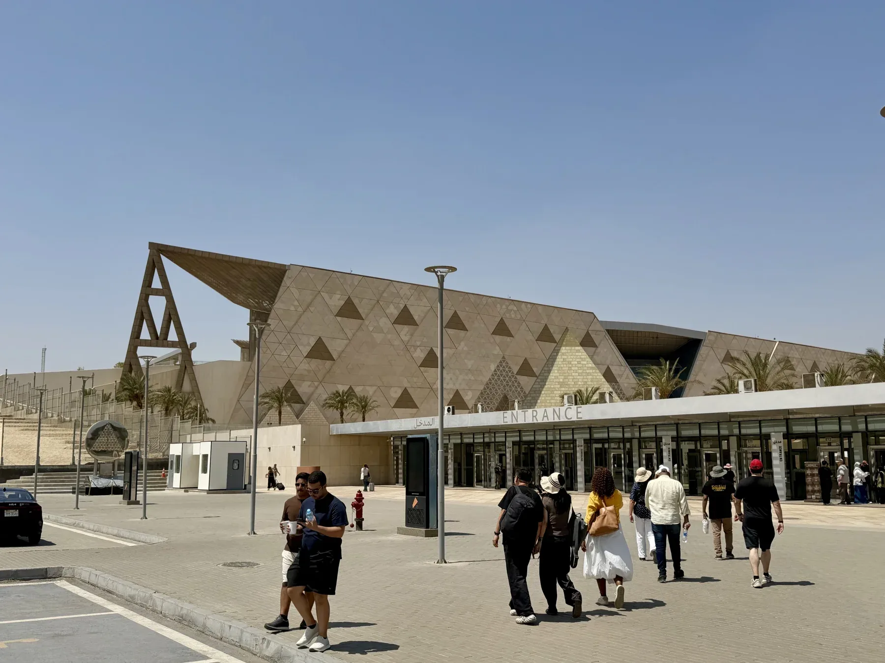 The exterior facade and visitor approach at the Grand Egyptian Museum.