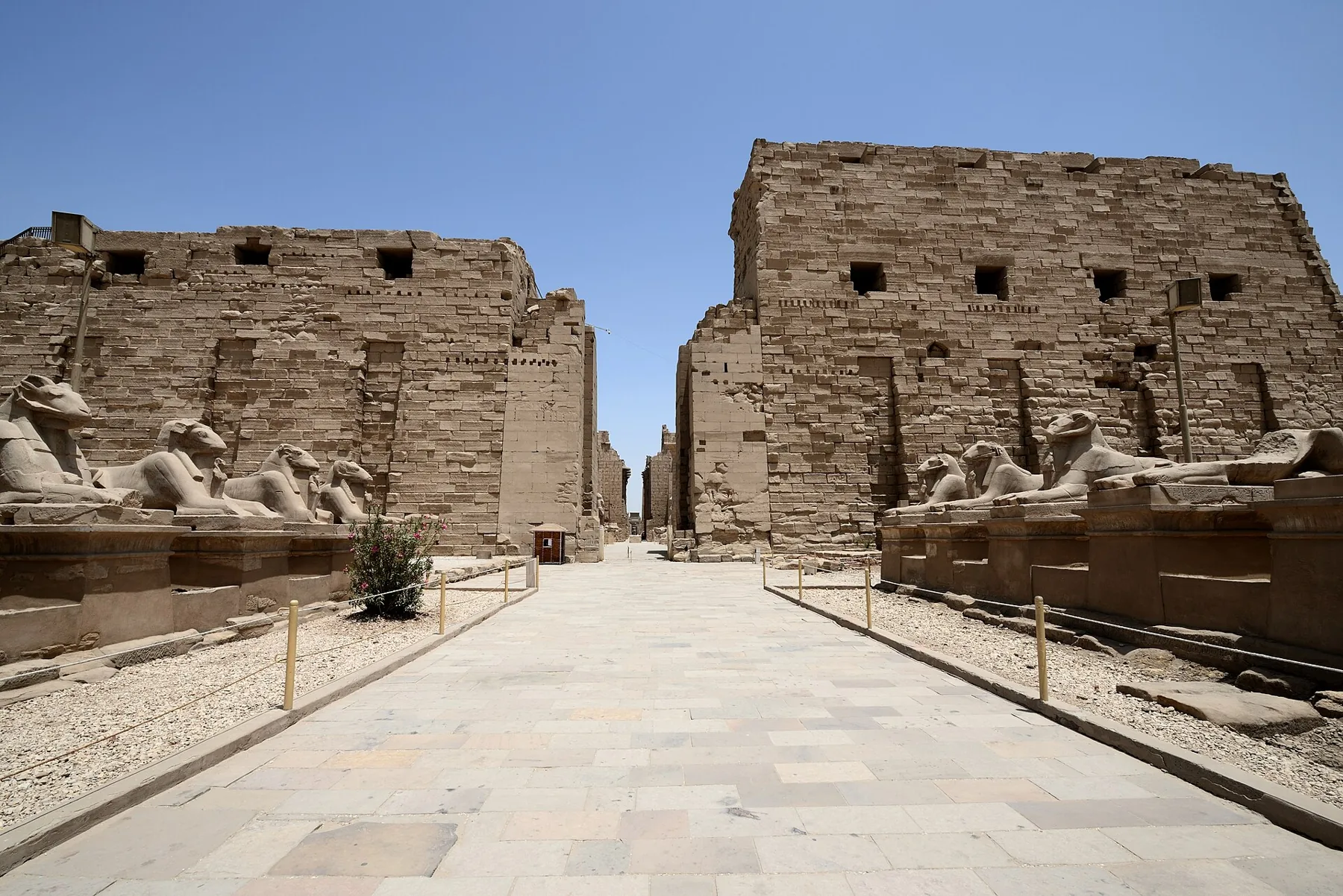 The first pylon of Karnak, with the avenue of ram-headed sphinxes leading to it.
